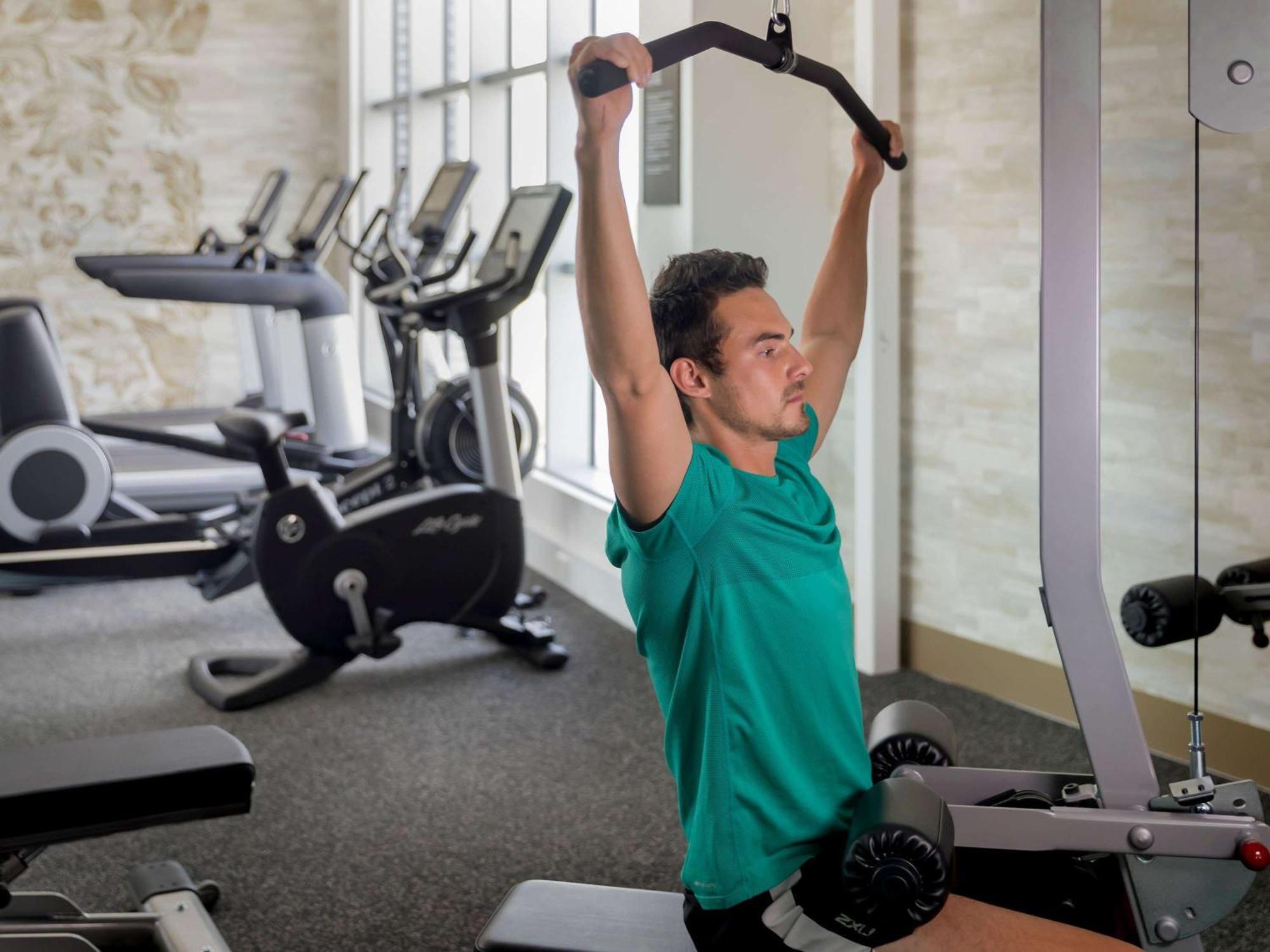 The William Inglis Mgallery Warwick Farm Exteriör bild A man performing a lat pulldown